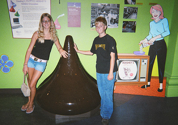 Larissa and Chris pose with a giant Hershey kiss at the Hershey Museum in Pennsylvania.
