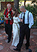 Barb is escorted up the aisle by her brothers Derrick and Ray.